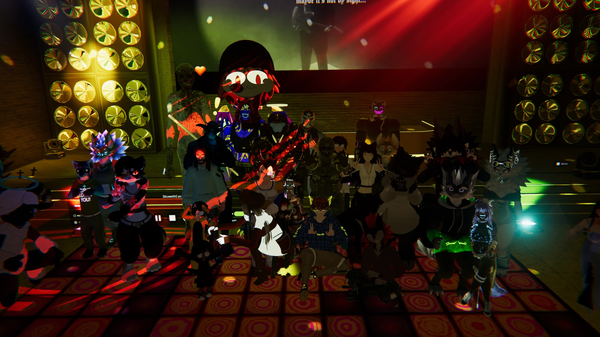 Worship and Games night: a crowd of avatars posing together on a lit dance floor between towers of stage lights, with a worship video on the screen behind them.